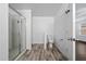 Bathroom showcasing a glass shower, toilet, and door leading to another room at 1951 Betsy Ross Ln, St Cloud, FL 34769