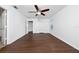 This bedroom boasts sleek, wood-look floors, complemented by a ceiling fan and bright natural light at 1951 Betsy Ross Ln, St Cloud, FL 34769