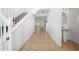 Bright entryway with tile floors, staircase, and half bath adds welcoming charm to the property at 1951 Betsy Ross Ln, St Cloud, FL 34769