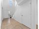 Bright entryway with tile floors, staircase, and white trim, creating a welcoming introduction at 1951 Betsy Ross Ln, St Cloud, FL 34769