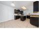 Modern kitchen with granite countertops, stainless steel appliances, and ample cabinet space at 1951 Betsy Ross Ln, St Cloud, FL 34769