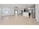 Spacious living room with tile floors and natural light from sliding doors, perfect for entertaining at 1951 Betsy Ross Ln, St Cloud, FL 34769