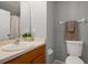 Bathroom featuring a vanity sink, toilet, and a shower with curtain at 10473 Glassborough Dr, Orlando, FL 32825