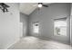 Spacious carpeted bedroom with two windows allowing natural light to illuminate the room at 10473 Glassborough Dr, Orlando, FL 32825