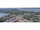 Community aerial view featuring the lake, landscaping, pool, and new construction at 1100 E Caroline St # 204, Tavares, FL 32778
