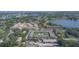 Aerial view showcasing the community, green spaces, and a refreshing swimming pool at 1100 E Caroline St # 204, Tavares, FL 32778