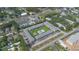Aerial view of a community showcasing a refreshing pool, verdant landscaping, and convenient parking for residents and guests at 1100 E Caroline St # 204, Tavares, FL 32778