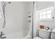 Clean bathroom with a shower and toilet at 1100 E Caroline St # 204, Tavares, FL 32778