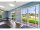 Bright community room with sliding glass doors and view of the pool at 1100 E Caroline St # 204, Tavares, FL 32778