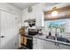 Bright kitchen boasts modern appliances, granite countertops, and ample cabinet space at 1100 E Caroline St # 204, Tavares, FL 32778