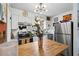 Modern kitchen with stainless steel appliances and a butcher block island next to dining area at 1100 E Caroline St # 204, Tavares, FL 32778