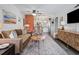 Inviting living room open to kitchen, featuring modern decor and comfortable seating at 1100 E Caroline St # 204, Tavares, FL 32778