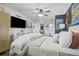Inviting main bedroom with TV, a comfortable bed, and convenient ensuite bathroom access, creating a private retreat at 1100 E Caroline St # 204, Tavares, FL 32778