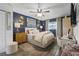 Serene main bedroom with plush bedding, elegant decor, and natural light from the window, complemented by wood-look floors at 1100 E Caroline St # 204, Tavares, FL 32778