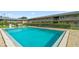 Inviting pool with clear blue water, surrounded by a brick deck and landscaped common areas at 1100 E Caroline St # 204, Tavares, FL 32778