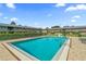 Beautiful community pool with inviting clear blue water and plenty of lounge seating around the deck at 1100 E Caroline St # 204, Tavares, FL 32778