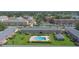 Inviting community pool area with lounge chairs and well-maintained landscaping at 1100 E Caroline St # 204, Tavares, FL 32778