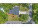 Aerial view of a home with a spacious backyard, a deck with an umbrella, and a private driveway at 1200 Ridge Rd, Longwood, FL 32750