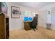 Comfortable bedroom with neutral-colored carpet, a built-in desk, and lots of closet space at 1200 Ridge Rd, Longwood, FL 32750