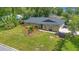 Aerial view showcasing a well-kept home with a landscaped front yard and mature trees at 1200 Ridge Rd, Longwood, FL 32750