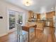 Eat-in kitchen with stainless steel appliances, wooden cabinets and access to the backyard at 1200 Ridge Rd, Longwood, FL 32750