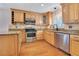 Gourmet kitchen featuring granite countertops, stainless steel appliances, and ample cabinet space at 1200 Ridge Rd, Longwood, FL 32750