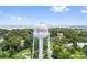 Scenic aerial view of Oakland, Florida water tower surrounded by a green landscape and blue skies at 121 W Oakland Ave, Oakland, FL 34760