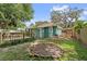 Green backyard with a small deck, home and shed, ready for outdoor living at 121 W Oakland Ave, Oakland, FL 34760