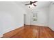Bright bedroom with hardwood floors, fresh paint and a ceiling fan at 121 W Oakland Ave, Oakland, FL 34760