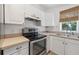 Kitchen featuring stainless steel appliances and double sink at 121 W Oakland Ave, Oakland, FL 34760