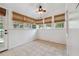 Sunroom with many windows and tile floor at 121 W Oakland Ave, Oakland, FL 34760