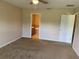 Comfortable bedroom featuring a ceiling fan and an en suite bathroom at 1227 Juniper Hammock St, Winter Garden, FL 34787