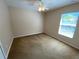 Bedroom with carpet, ceiling fan and window at 1227 Juniper Hammock St, Winter Garden, FL 34787