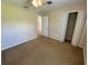 This bedroom features neutral walls, carpet floors, a ceiling fan, and a closet at 1227 Juniper Hammock St, Winter Garden, FL 34787