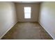 This empty bedroom has carpet and a window at 1227 Juniper Hammock St, Winter Garden, FL 34787
