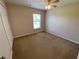 This bedroom features neutral walls, carpet floors, a ceiling fan, and a window with blinds at 1227 Juniper Hammock St, Winter Garden, FL 34787
