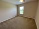 Neutral bedroom with carpet, ceiling fan, and window at 1227 Juniper Hammock St, Winter Garden, FL 34787