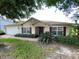 Charming single-story home with well-maintained landscaping and a two-car garage at 1227 Juniper Hammock St, Winter Garden, FL 34787