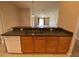 Kitchen area with cabinets and view of the living area at 1227 Juniper Hammock St, Winter Garden, FL 34787