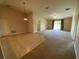 Spacious living room with natural light, ceiling fan, and a sliding glass door to the exterior at 1227 Juniper Hammock St, Winter Garden, FL 34787