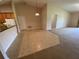 Open-concept living area featuring a combination of carpet and tile flooring at 1227 Juniper Hammock St, Winter Garden, FL 34787