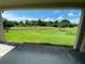 Back porch with a view of the backyard pond at 1227 Juniper Hammock St, Winter Garden, FL 34787