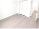 Bedroom featuring a closet, sleek flooring, and a neutral palette, offering a serene and modern living space at 1309 Hillsborough Ln, Kissimmee, FL 34759