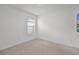 Empty bedroom with neutral carpet, a window, and clean, bright walls at 1351 Fox Squirrel Dr, Davenport, FL 33897
