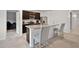 Modern kitchen area with breakfast bar seating and open layout at 1351 Fox Squirrel Dr, Davenport, FL 33897