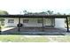 View of a covered carport area with ample space and convenient access to the home at 1390 E Airport Blvd, Sanford, FL 32773