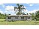 Charming single-story home featuring a well-maintained lawn and inviting curb appeal at 1390 E Airport Blvd, Sanford, FL 32773