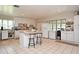Well-lit, expansive kitchen with a functional island, ample appliances, and abundant counter space at 1390 E Airport Blvd, Sanford, FL 32773