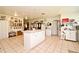 Large kitchen offering ample space for cooking and storage with an island and bright lighting at 1390 E Airport Blvd, Sanford, FL 32773