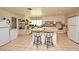 Spacious kitchen featuring white appliances, central island, and tiled flooring at 1390 E Airport Blvd, Sanford, FL 32773